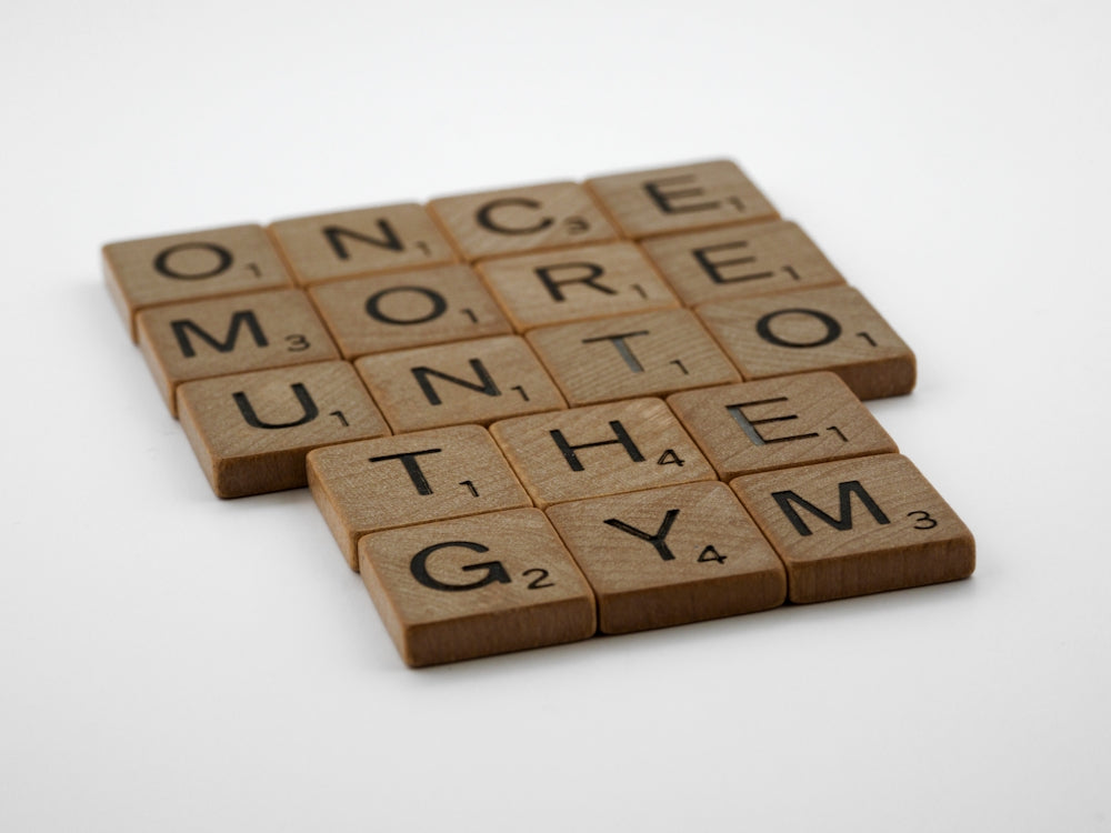 a couple of scrabble tiles sitting on top of a table